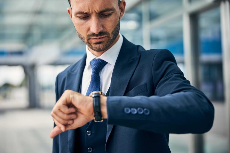 Man wearing luxury wristwatch on left wrist with proper styling
