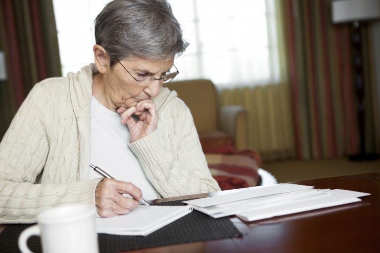 Elderly-woman-doing-paperwork-1024x682