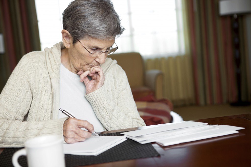 Elderly-woman-doing-paperwork-1024x682