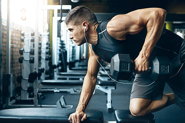 Shot of a man doing weight training at the gym